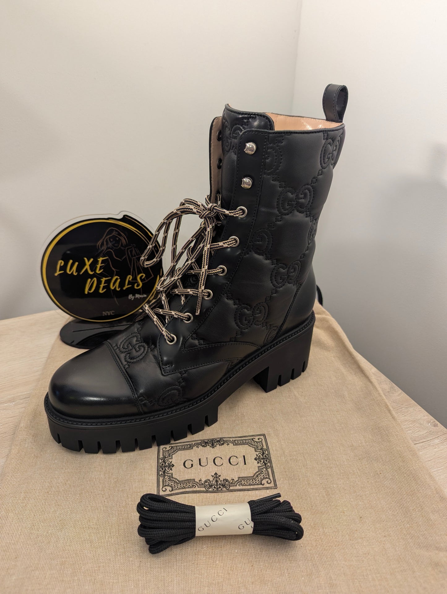 Gucci Embossed Signature Combat Boots