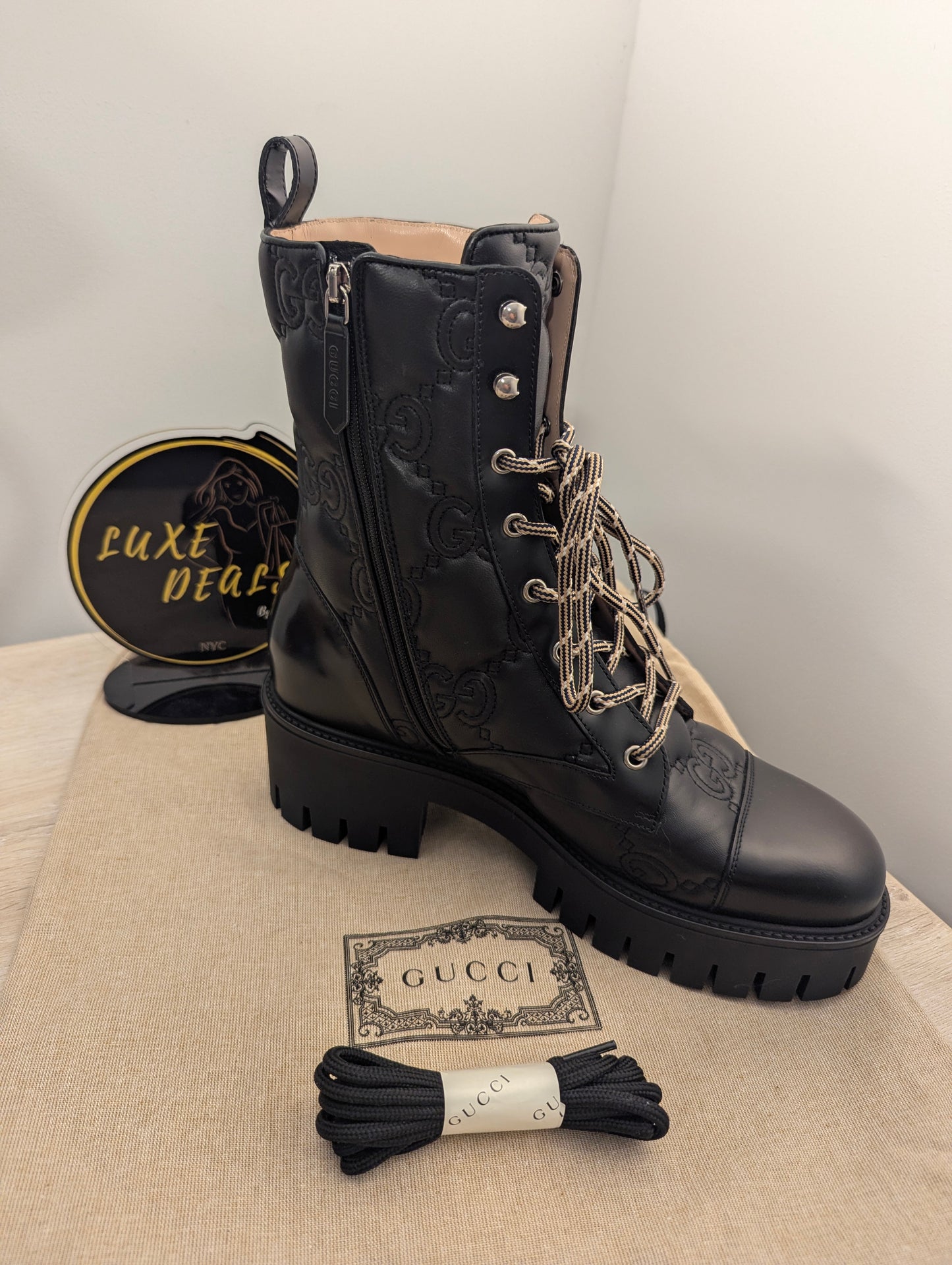 Gucci Embossed Signature Combat Boots