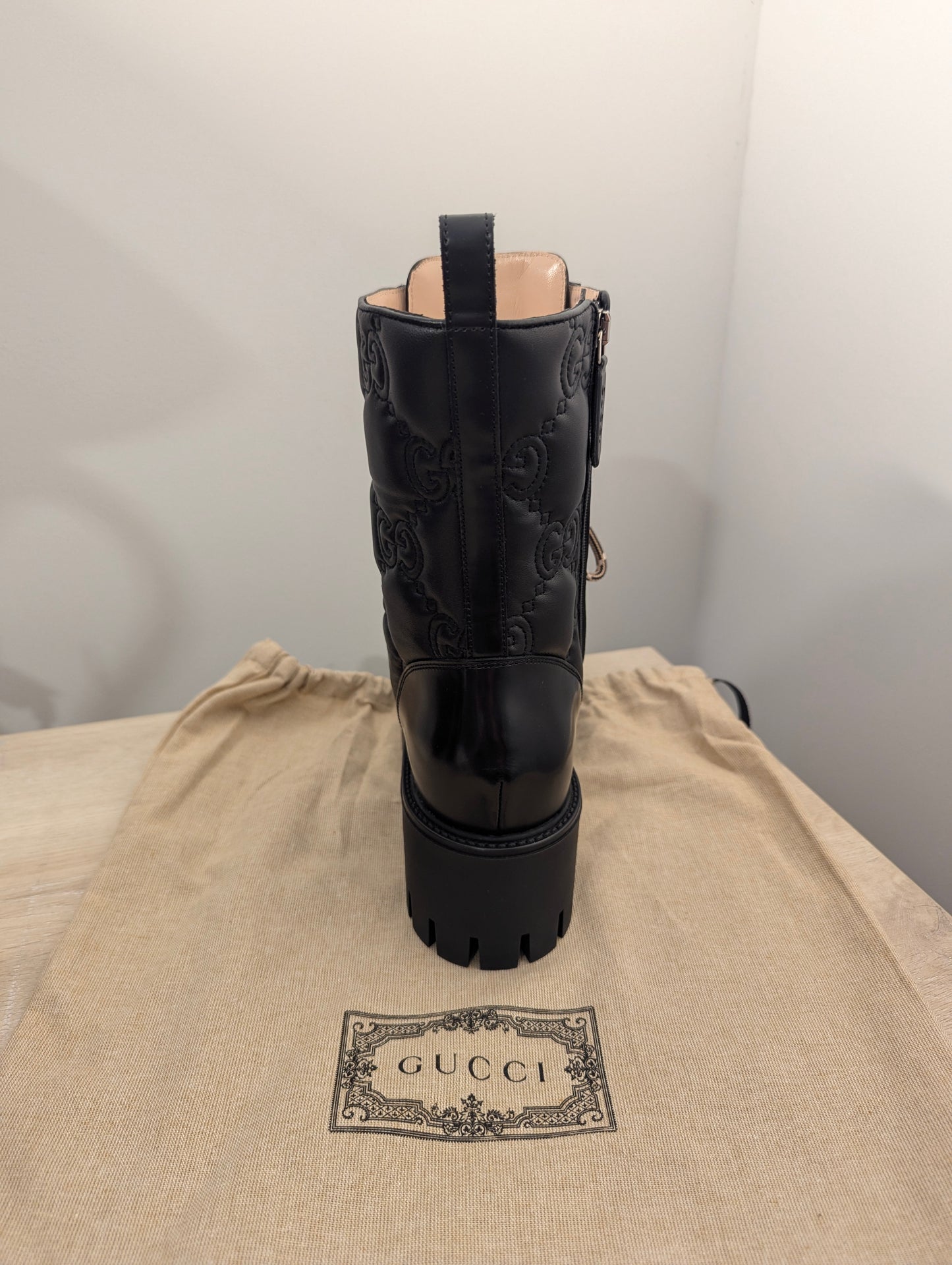 Gucci Embossed Signature Combat Boots